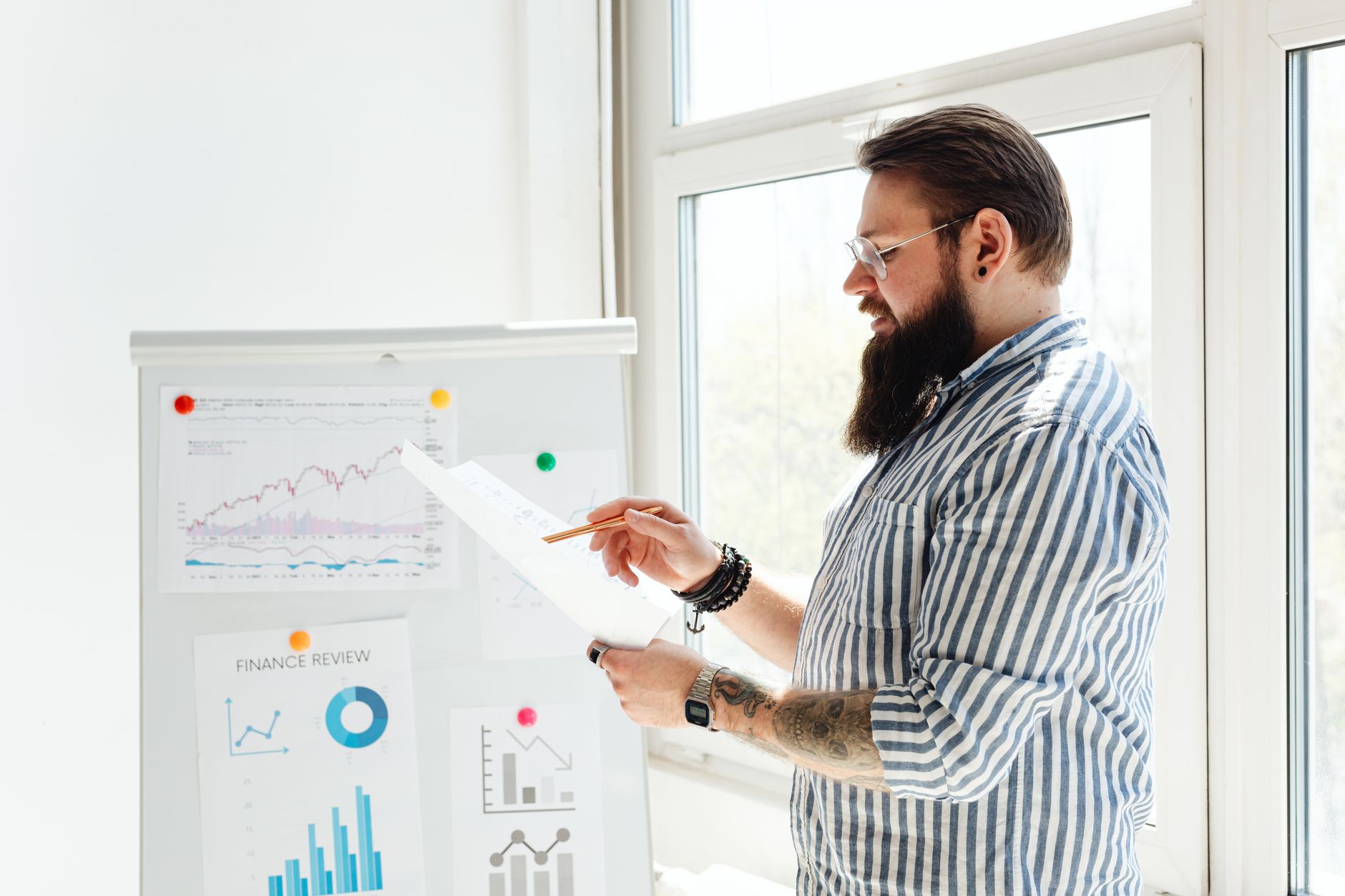 Business professional analyzing statistical charts